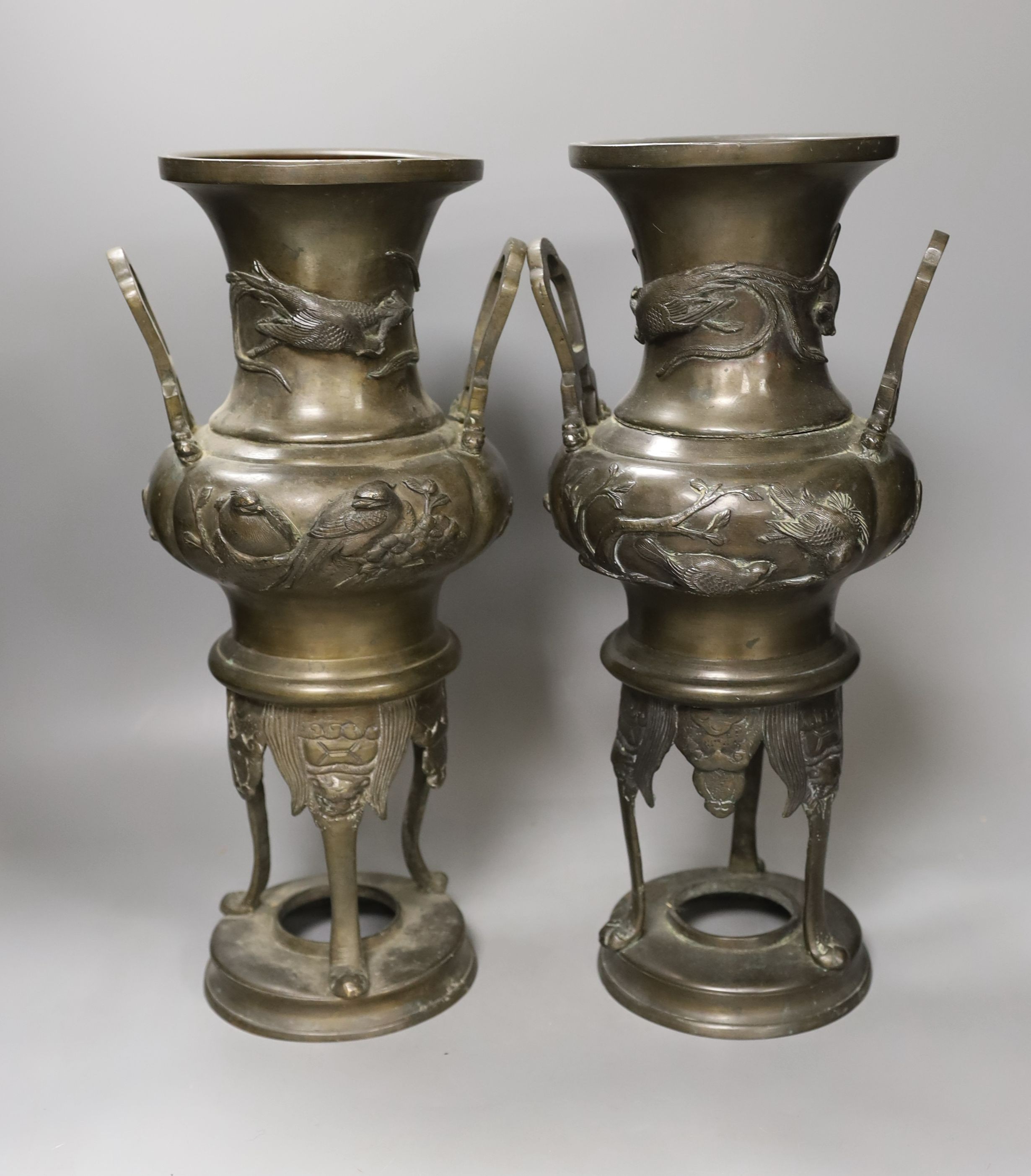 A pair of Japanese bronze vases, one handle a.f. - 40cm tall